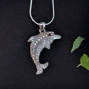 Stunning large dolphin pendant with lots of bling.